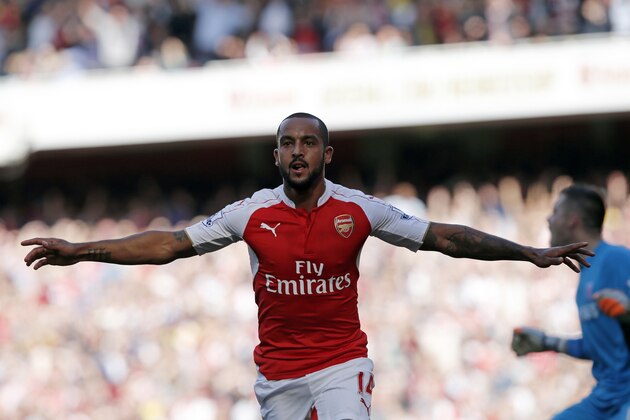 Arsenal's English midfielder Theo Walcott celebrates scoring the opening goal during the English Premier League football match between Arsenal and Stoke City at the Emirates Stadium in London on September 12, 2015. AFP PHOTO / ADRIAN DENNIS
RESTRICTED TO EDITORIAL USE. No use with unauthorised audio, video, data, fixture lists, club/league logos or 'live' services. Online in-match use limited to 45 images, no video emulation. No use in betting, games or single club/league/player publications. (Photo credit should read ADRIAN DENNIS/AFP/Getty Images) Arsenal's English midfielder Theo Walcott celebrates scoring the opening goal during the English Premier League football match between Arsenal and Stoke City at the Emirates Stadium in London on September 12, 2015. AFP PHOTO / ADRIAN DENNIS
RESTRICTED TO EDITORIAL USE. No use with unauthorised audio, video, data, fixture lists, club/league logos or 'live' services. Online in-match use limited to 45 images, no video emulation. No use in betting, games or single club/league/player publications. (Photo credit should read ADRIAN DENNIS/AFP/Getty Images)