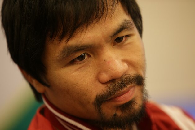 Filipino boxing icon Manny Pacquiao listens to questions during an interview in suburban Pasay, south of Manila, Philippines on Wednesday, Sept. 16, 2015. Pacquiao said boxing is not his main focus these days and a rematch with Floyd Mayweather may not happen because the American champion said he was retiring. (AP Photo/Aaron Favila)