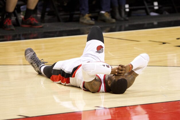 Mar 5, 2015; Portland, OR, USA; Portland Trail Blazers guard Wesley Matthews (2) grimaces in pain in the third quarter against Dallas Mavericks at Moda Center at the Rose Quarter. Mandatory Credit: Jaime Valdez-USA TODAY Sports