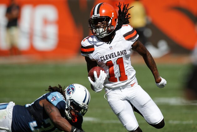 CLEVELAND, OH - SEPTEMBER 20: Travis Benjamin #11 of the Cleveland Browns returns a second quarter punt for a touchdown while playing the Tennessee Titans at FirstEnergy Stadium on September 20, 2015 in Cleveland, Ohio.  (Photo by Gregory Shamus/Getty Images)