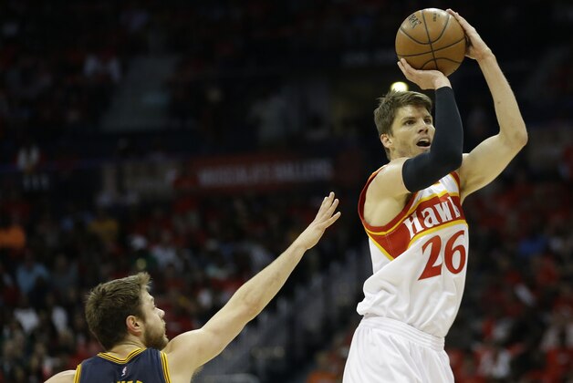 Atlanta Hawks guard Kyle Korver (26) shoots against Cleveland Cavaliers guard Matthew Dellavedova (8) during the first half in Game 2 of the Eastern Conference finals of the NBA basketball playoffs, Friday, May 22, 2015, in Atlanta. (AP Photo/David Goldman)