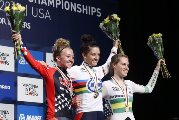 Chloe Dygert, of the United States, center, celebrates her Junior Women's Time Trial win with second place finisher, Emma White, left, of the US and third place finisher, Anna-Leeza Hull, of Australia, right, after the Women's Time Trials  for the UCI Road World Championships in Richmond, Va., Monday, Sept. 21, 2015.   (AP Photo/Steve Helber)