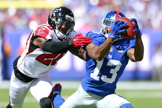 New York Giants wide receiver Odell Beckham Jr. #13 makes a catch in front of Atlanta Falcons defensive back Phillip Adams #20 during an NFL game at MetLife Stadium in East Rutherford, N.J. on Sunday, Sept. 20, 2015. (AP Photo/Brad Penner)