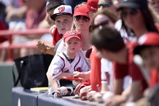 Mar 19, 2015; Melbourne, FL, USA;  Washington Nationals fans wait for autographs before the game against the Detroit Tigers at Space Coast Stadium. Mandatory Credit: Brad Barr-USA TODAY Sports