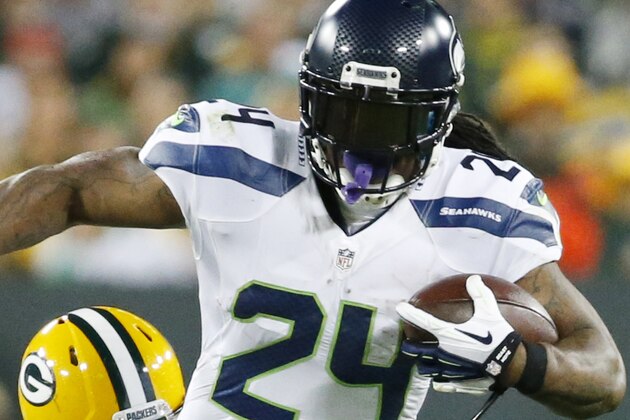 Green Bay Packers' Nick Perry stops Seattle Seahawks' Marshawn Lynch (24) during the first half of an NFL football game Sunday, Sept. 20, 2015, in Green Bay, Wis. (AP Photo/Mike Roemer)