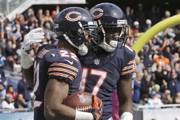 Chicago Bears running back Matt Forte (22) celebrates his touchdown with receiver Alshon Jeffery (17) during the second half of an NFL football game against the Miami Dolphins Sunday, Oct. 19, 2014 in Chicago. (AP Photo/Nam Y. Huh)