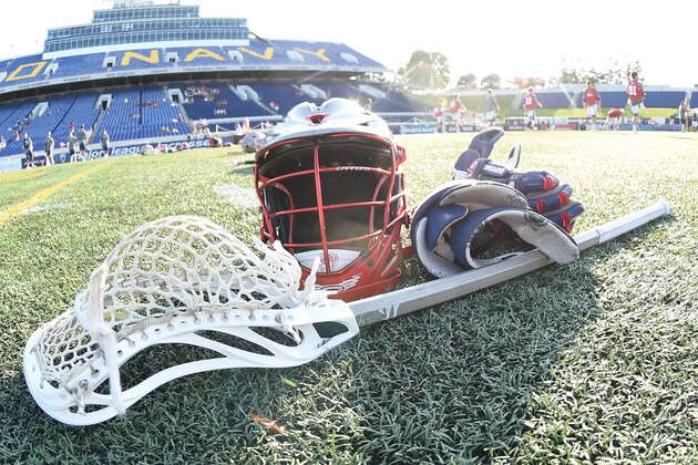 ANNAPOLIS, MD - JULY 16:   Boston Cannons stick, helmet and gloves on the field before a MLL Lacrosse game against the Chesapeake Bayhawks at Navy-Marine Corps Memorial Stadium on July 16, 2015 in Annapolis, Maryland.  (Photo by Mitchell Layton/Getty Images)