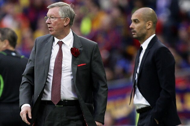 Manchester United's manager Alex Ferguson, left, and Barcelona's coach Pep Guardiola look on during their Champions League final soccer match at Wembley Stadium, London, Saturday, May 28, 2011. (AP Photo/Jon Super)