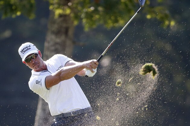 Henrik Stenson, of Sweden, hits from the rough on the 13th hole during the final round of the Deutsche Bank Championship golf tournament in Norton, Mass., Monday, Sept. 7, 2015. (AP Photo/Michael Dwyer)
