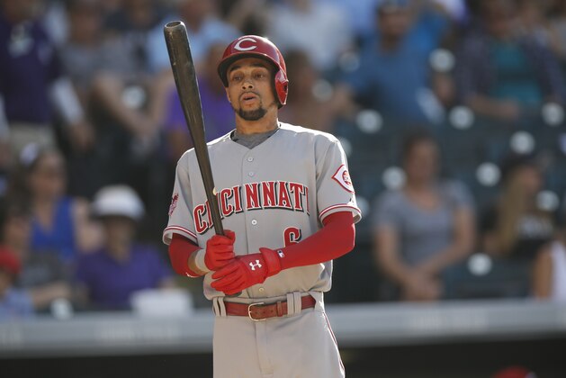 Cincinnati Reds center fielder Billy Hamilton (6) bats against the Colorado Rockies in the ninth inning of a baseball game Sunday, July 26, 2015, in Denver. Colorado won 17-7. (AP Photo/David Zalubowski)