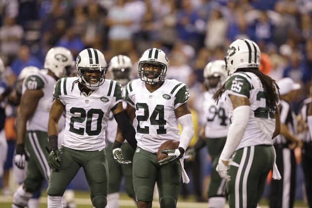New York Jets cornerback Darrelle Revis (24) celebrates a fumble recovery with cornerback Marcus Williams (20) during the second half of an NFL football game against the Indianapolis Colts in Indianapolis, Monday, Sept. 21, 2015. (AP Photo/Darron Cummings)