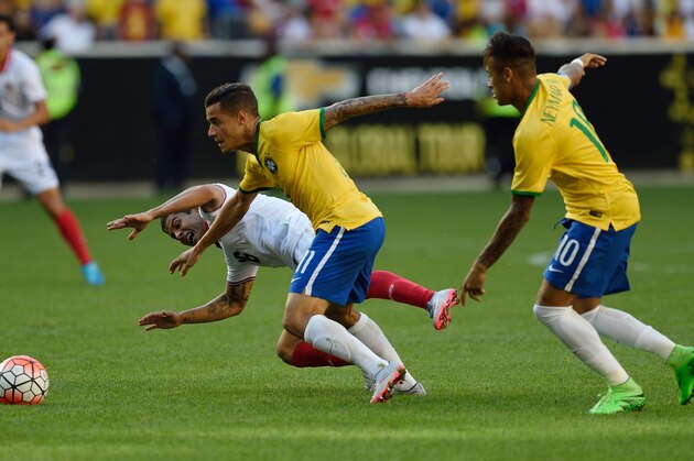Brazil's Philippe Coutinho (11) makes his way toward the goal past Costa Rica's Christian Gamboa and in front of Brazil's Neymar (10) during the friendly match between Brazil and Costa Rica on September 5, 2015 at Red Bulls Arena in Harrison, New Jersey. AFP PHOTO/DON EMMERT        (Photo credit should read DON EMMERT/AFP/Getty Images)