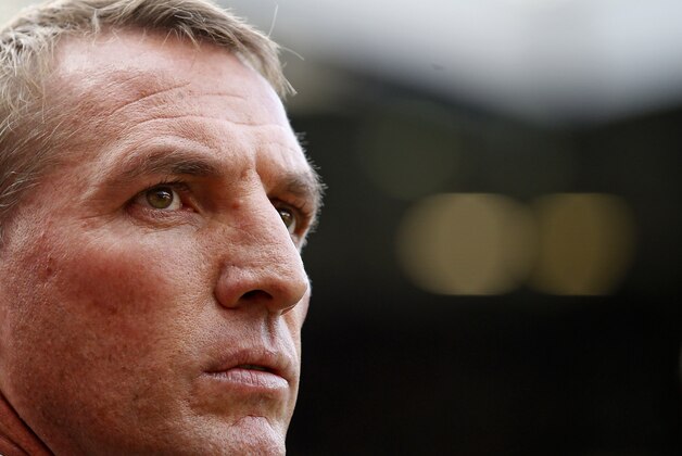 Liverpool manager Brendan Rodgers stands on the touchline before the English Premier League soccer match between Manchester United and Liverpool at Old Trafford Stadium, Manchester, England, Saturday, Sept. 12, 2015. (AP Photo/Jon Super)