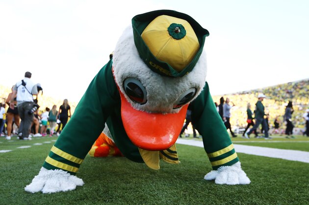 The Oregon Duck does push-ups during the first half of an NCAA college football game against Eastern Washington Saturday, Sept. 5, 2015, in Eugene, Ore. (AP Photo/Ryan Kang)