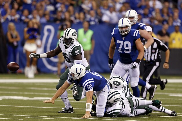 Sep 21, 2015; Indianapolis, IN, USA; Indianapolis Colts quarterback (15) Andrew Luck fumbles the ball against New York Jets defensive end Muhammad Wilkerson (96) at Lucas Oil Stadium. Mandatory Credit: Brian Spurlock-USA TODAY Sports