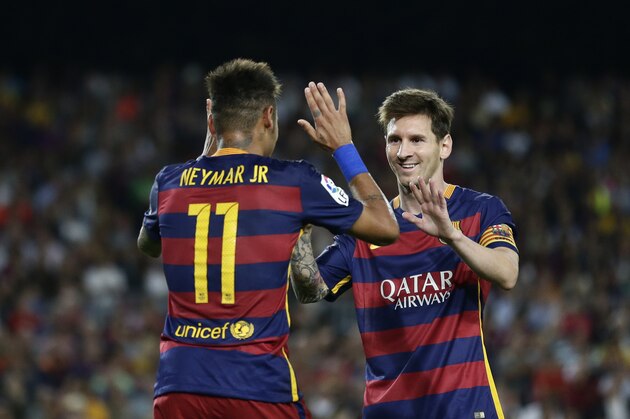 FC Barcelona's Lionel Messi, left, celebrates after scoring with teammate Neymar during a Spanish La Liga soccer match against Levante at the Camp Nou stadium in Barcelona, Spain, Sunday, Sept. 20, 2015. (AP Photo/Manu Fernandez)