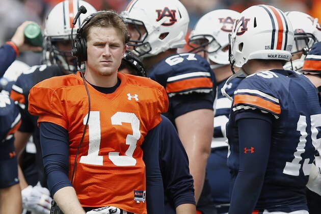 Auburn quarterback Sean White (13) walks around the field in the second half during their spring NCAA college football game, Saturday, April 18, 2015, in Auburn, Ala. (AP Photo/Brynn Anderson)