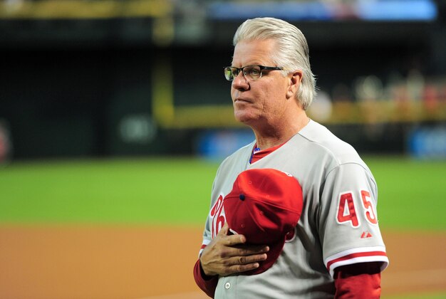 Aug 11, 2015; Phoenix, AZ, USA; Philadelphia Phillies interim manager Pete Mackanin (45) looks on during the national anthem prior to facing the Arizona Diamondbacks at Chase Field. Mandatory Credit: Joe Camporeale-USA TODAY Sports