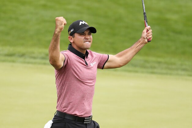 Jason Day, of Australia, celebrates his eagle putt on the 18th green during the second round of the BMW Championship golf tournament at Conway Farms Golf Club, Friday, Sept. 18, 2015, in Lake Forest, Ill. (AP Photo/Charles Rex Arbogast)