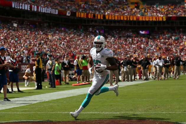 LANDOVER, MD - SEPTEMBER 13: Wide receiver Rishard Matthews #18 of the Miami Dolphins scores a first half touchdown during a game against the Washington Redskins at FedExField on September 13, 2015 in Landover, Maryland. (Photo by Patrick Smith/Getty Images)