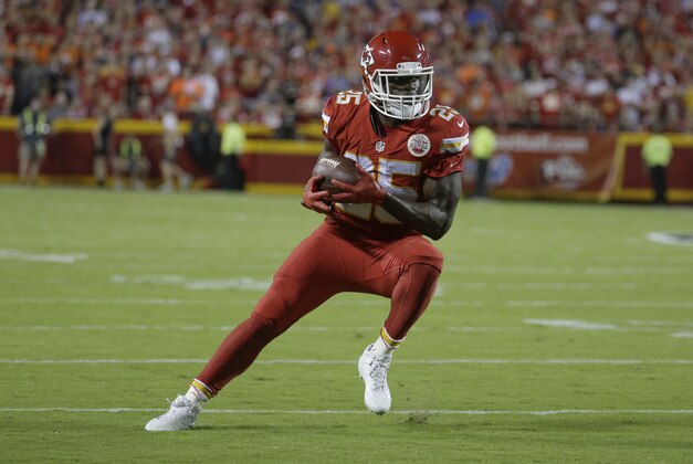 Kansas City Chiefs running back Jamaal Charles (25) rns with the ball during the first half of an NFL football game against the Denver Broncos in Kansas City, Mo., Thursday, Sept. 17, 2015. (AP Photo/Charlie Riedel)