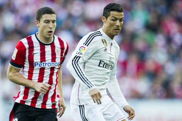 BILBAO, SPAIN - MARCH 07:  Cristiano Ronaldo of Real Madrid CF duels for the ball withÊOscar De Marcos of Athletic Club Bilbao during the La Liga match between Athletic Club Bilbao and Real Madrid CF at San Mames Stadium on March 7, 2015 in Bilbao, Spain.  (Photo by Juan Manuel Serrano Arce/Getty Images)