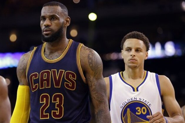 Cleveland Cavaliers forward LeBron James (23) walks in front of Golden State Warriors guard Stephen Curry (30) during the first half of Game 5 of basketball's NBA Finals in Oakland, Calif., Sunday, June 14, 2015. (AP Photo/Ben Margot)