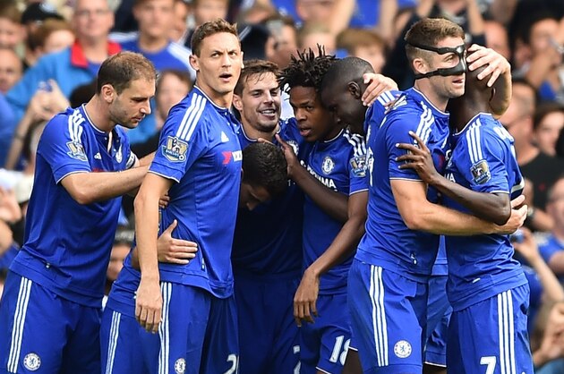 Chelsea players celebrate after scoring their second goal during the English Premier League football match between Chelsea and Arsenal at Stamford Bridge in London on September 19, 2015. Chelsea won the game 2-0. AFP PHOTO / BEN STANSALL

RESTRICTED TO EDITORIAL USE. No use with unauthorized audio, video, data, fixture lists, club/league logos or 'live' services. Online in-match use limited to 75 images, no video emulation. No use in betting, games or single club/league/player publications.        (Photo credit should read BEN STANSALL/AFP/Getty Images)