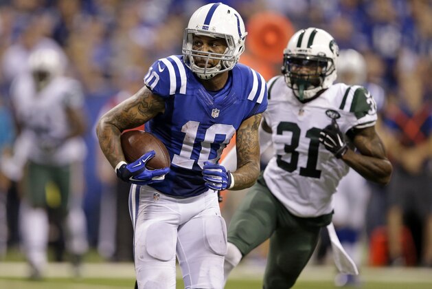 Indianapolis Colts wide receiver Donte Moncrief (10) runs to the end zone for a touchdown in front of New York Jets cornerback Antonio Cromartie (31) in the second half of an NFL football game in Indianapolis, Monday, Sept. 21, 2015.  (AP Photo/Darron Cummings)