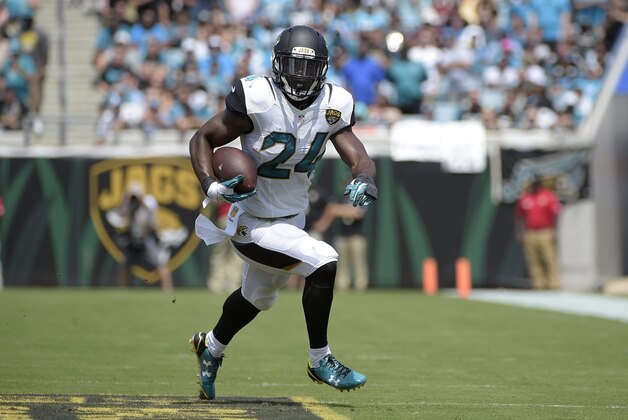 Jacksonville Jaguars running back T.J. Yeldon (24) rushes for yardage during the first half of an NFL football game against the Carolina Panthers in Jacksonville, Fla., Sunday, Sept. 13, 2015. (AP Photo/Phelan M. Ebenhack)