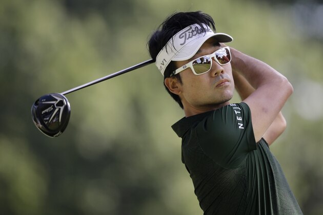 Kevin Na tees off on the 11th hole during the second round of the Bridgestone Invitational golf tournament at Firestone Country Club, Friday, Aug. 7, 2015, in Akron, Ohio. (AP Photo/Tony Dejak)