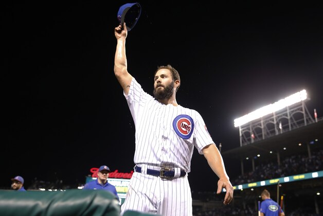 Chicago Cubs starting pitcher Jake Arrieta waves to fans after a 4-0 win over the Milwaukee Brewers in a baseball game Tuesday, Sept. 22, 2015, in Chicago. Arrieta became the majors’ first 20-game winner of the season. (AP Photo/Charles Rex Arbogast)