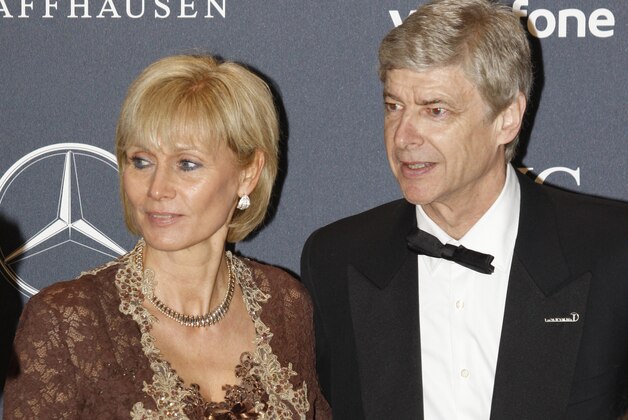 Arsenal soccer team coach Arsene Wenger with his wife Annie,  arrives for the Laureus World Sports Awards in London, Monday Feb. 6, 2012. (AP Photo/Lefteris Pitarakis)
