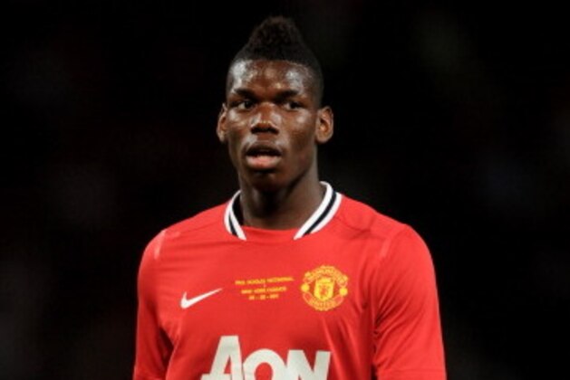 MANCHESTER, ENGLAND - AUGUST 05:  Paul Pogba of Manchester United looks on during Paul Scholes' Testimonial Match between Manchester United and New York Cosmos at Old Trafford on August 5, 2011 in Manchester, England.  (Photo by Chris Brunskill/Getty Images)