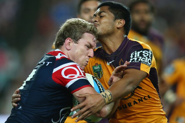 SYDNEY, AUSTRALIA - AUGUST 22:  Mitchell Aubusson of the Roosters is tackled during the round 24 NRL match between the Sydney Roosters and the Brisbane Broncos at Allianz Stadium on August 22, 2015 in Sydney, Australia.  (Photo by Mark Kolbe/Getty Images)