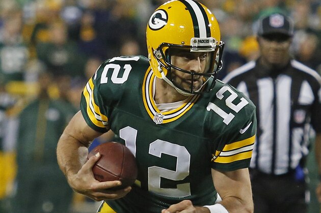 Green Bay Packers quarterback Aaron Rodgers rushes against the Seattle Seahawks during an NFL football game Sunday Sept. 20, 2015, in Green Bay, Wis. (AP Photo/Matt Ludtke)
