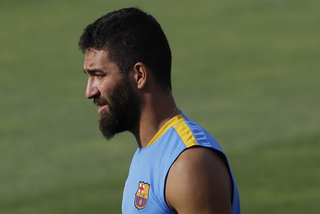 FC Barcelona's Arda Turan looks on during a training session at the Sports Center FC Barcelona Joan Gamper in the San Joan Despi, Spain, Wednesday, July 15, 2015. (AP Photo/Manu Fernandez)