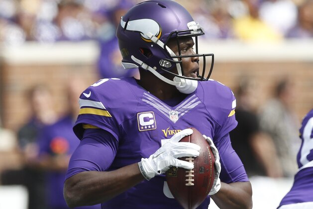 Minnesota Vikings quarterback Teddy Bridgewater (5) readies to throw against the Detroit Lions in the first half of an NFL football game in Minneapolis, Sunday, Sept. 20, 2015. (AP Photo/Jim Mone)