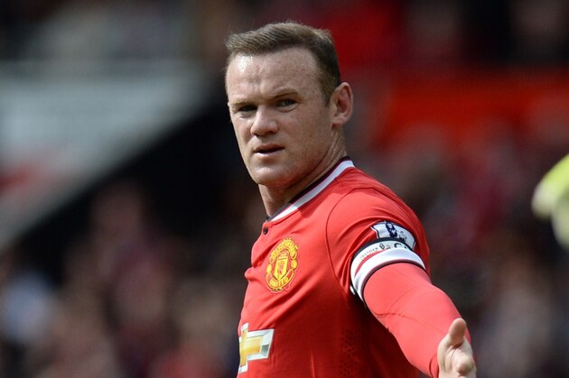 Manchester United's English striker Wayne Rooney appeals for Aston Villa's US goalkeeper Brad Guzan to release the ball during the English Premier League football match between Manchester United and Aston Villa at Old Trafford in Manchester, North West England on April 4, 2015. AFP PHOTO / OLI SCARFF 

RESTRICTED TO EDITORIAL USE. No use with unauthorized audio, video, data, fixture lists, club/league logos or live services. Online in-match use limited to 45 images, no video emulation. No use in betting, games or single club/league/player publications.        (Photo credit should read OLI SCARFF/AFP/Getty Images)