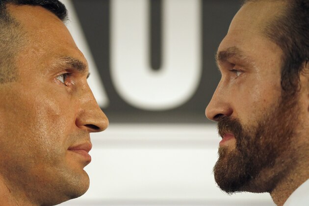 World Heavyweight boxing champion  Wladimir Klitschko, left, and British heavyweight Tyson Fury stare at each other  during a press conference in London, Wednesday, Sept. 23, 2015.  Klitschko will fight Fury in a heavyweight title bout on Oct. 24,  in Duesseldorf, Germany.(AP Photo/Frank Augstein)