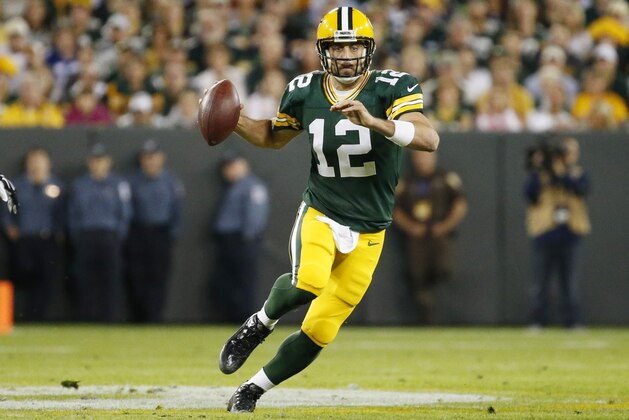 Green Bay Packers' Aaron Rodgers runs during the first half of an NFL football game against the Seattle Seahawks Sunday, Sept. 20, 2015, in Green Bay, Wis. (AP Photo/Mike Roemer)
