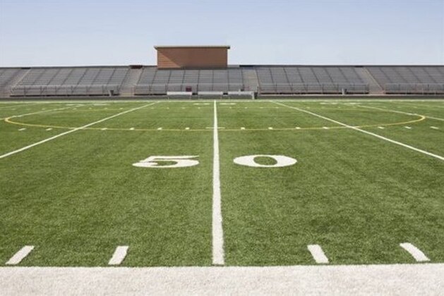 Football field and stadium (Photo by: Tetra Images/AP Images)