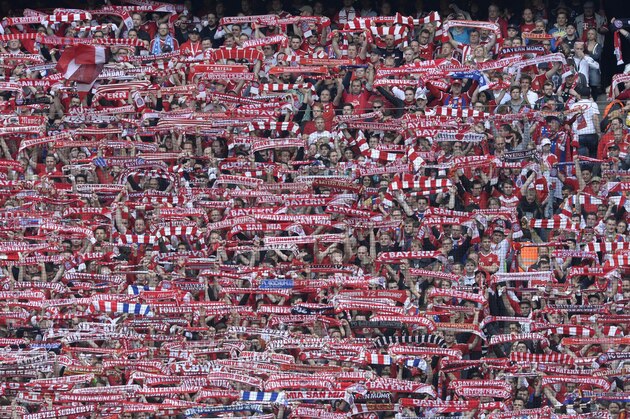 Supporters of FC Bayern Munich cheer during the German first division Bundesliga football match between FC Bayern Muenchen vs Eintracht Frankfurt in Munich, Germany, on April 11, 2015.  AFP PHOTO /  CHRISTOF STACHE

RESTRICTIONS - DFL RULES TO LIMIT THE ONLINE USAGE DURING MATCH TIME TO 15 PICTURES PER MATCH. IMAGE SEQUENCES TO SIMULATE VIDEO IS NOT ALLOWED AT ANY TIME. FOR FURTHER QUERIES PLEASE CONTACT DFL DIRECTLY AT + 49 69 650050.        (Photo credit should read CHRISTOF STACHE/AFP/Getty Images)