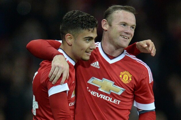Manchester United's Belgian midfielder Andreas Pereira (L) celebrates with Manchester United's English striker Wayne Rooney after scoring their second goal from a free-kick during the English League Cup third round football match between Manchester United and Ipswich Town at Old Trafford in Manchester, north west England on September 23, 2015. AFP PHOTO / OLI SCARFF
RESTRICTED TO EDITORIAL USE. No use with unauthorized audio, video, data, fixture lists, club/league logos or 'live' services. Online in-match use limited to 75 images, no video emulation. No use in betting, games or single club/league/player publications. (Photo credit should read OLI SCARFF/AFP/Getty Images) Manchester United's Belgian midfielder Andreas Pereira (L) celebrates with Manchester United's English striker Wayne Rooney after scoring their second goal from a free-kick during the English League Cup third round football match between Manchester United and Ipswich Town at Old Trafford in Manchester, north west England on September 23, 2015. AFP PHOTO / OLI SCARFF
RESTRICTED TO EDITORIAL USE. No use with unauthorized audio, video, data, fixture lists, club/league logos or 'live' services. Online in-match use limited to 75 images, no video emulation. No use in betting, games or single club/league/player publications. (Photo credit should read OLI SCARFF/AFP/Getty Images)