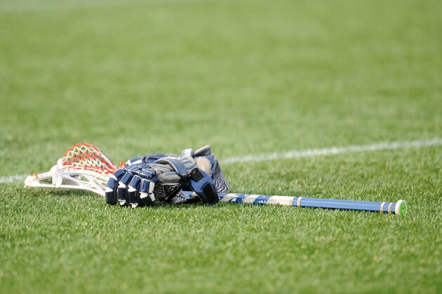 ANNAPOLIS, MD - JULY 31:  A Chesapeake Bayhawks stick and gloves on the field before a Major League Lacrosse game against the Denver Outlaws on July 31, 2014 at Navy-Marine Corps Memorial Stadium in Annapolis, Maryland.  The Outlaws won 18-16.  (Photo by Mitchell Layton/Getty Images)