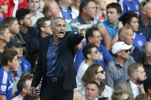 Chelsea manager Jose Mourinho points to his players as he watches his side from the touchline during the English Premier League soccer match between Chelsea and Arsenal at Stamford Bridge stadium in London, Saturday, Sept. 19, 2015. Chelsea won the match 2-0.(AP Photo/Alastair Grant)