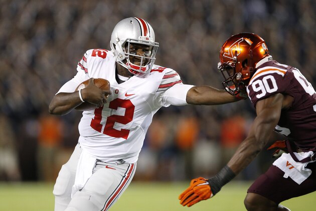 BLACKSBURG, VA - SEPTEMBER 7: Cardale Jones #12 of the Ohio State Buckeyes tries to run the ball past Dadi L'homme Nicolas #90 of the Virginia Tech Hokies in the first quarter at Lane Stadium on September 7, 2015 in Blacksburg, Virginia. (Photo by Joe Robbins/Getty Images)