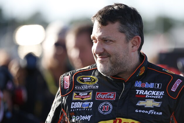 Sep 11, 2015; Richmond, VA, USA; Sprint Cup Series driver Tony Stewart (14) looks on prior to qualifying for the Federated Auto Parts 400 at Richmond International Raceway. Mandatory Credit: Amber Searls-USA TODAY Sports