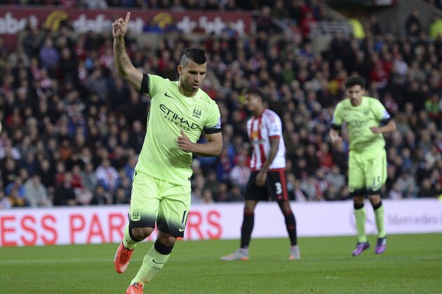 Manchester City's Argentinian striker Sergio Aguero celerbates scoring the opening goal from the penalty spot during the English League Cup third round football match between Sunderland and Manchester City at the Stadium of Light in Sunderland, northest England, on September 22, 2015. AFP PHOTO / OLI SCARFF

RESTRICTED TO EDITORIAL USE. No use with unauthorized audio, video, data, fixture lists, club/league logos or 'live' services. Online in-match use limited to 75 images, no video emulation. No use in betting, games or single club/league/player publications.        (Photo credit should read OLI SCARFF/AFP/Getty Images)