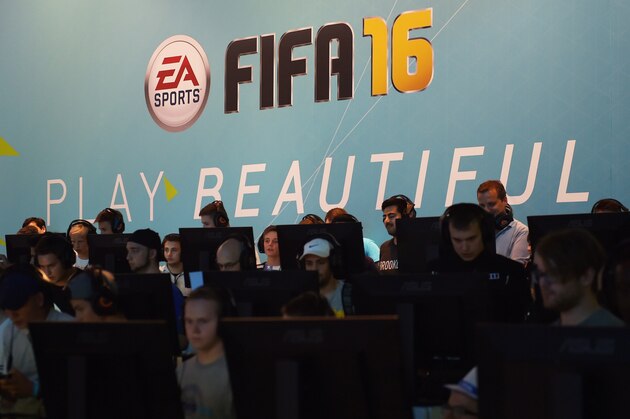 Visitors try out the FIFA 16 football game at the Gamescom fair in Cologne, western Germany on August 7, 2015. The trade fair for interactive games is running until August 9, 2014. PHOTO / PATRIK STOLLARZ (Photo credit should read PATRIK STOLLARZ/AFP/Getty Images) Visitors try out the FIFA 16 football game at the Gamescom fair in Cologne, western Germany on August 7, 2015. The trade fair for interactive games is running until August 9, 2014. PHOTO / PATRIK STOLLARZ (Photo credit should read PATRIK STOLLARZ/AFP/Getty Images)